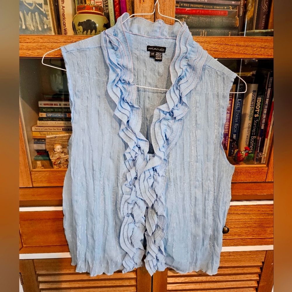 Feminine sleeveless ruffled blouse
